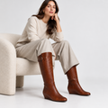 Fey Wedge Boot Cognac Leather – worn by a model